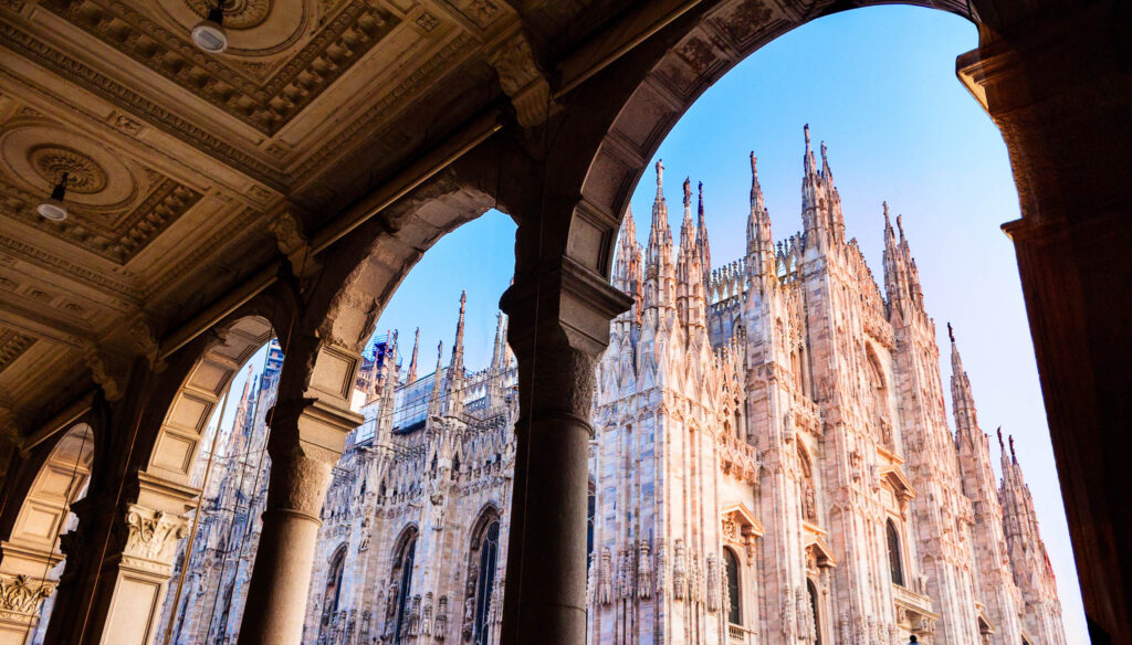 View of Milan Cathedral through the arches of the historic city centre