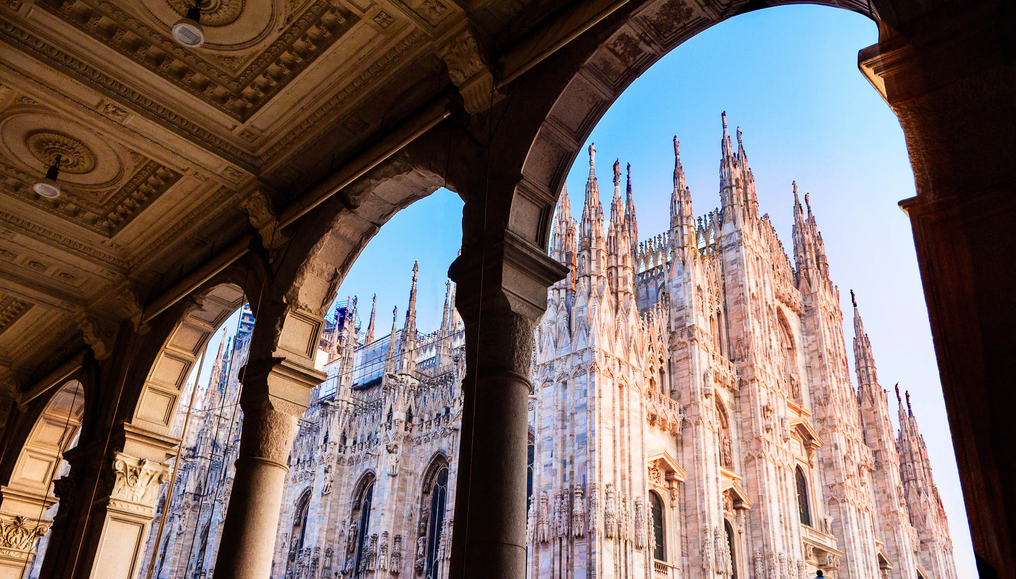 View of Milan Cathedral through the arches of the historic city centre
