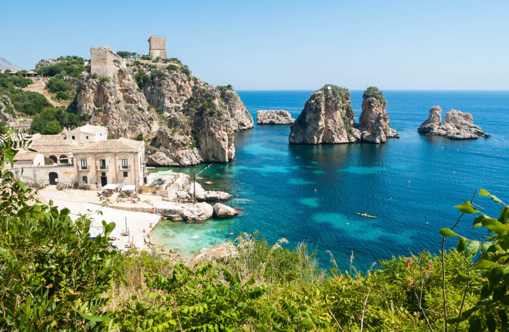 Rocky Mediterranean coastline and turquoise sea in Sicily
