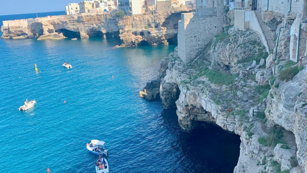 Rocky coastline and turquoise Adriatic Sea in Polignano a Mare, Puglia, Italy.