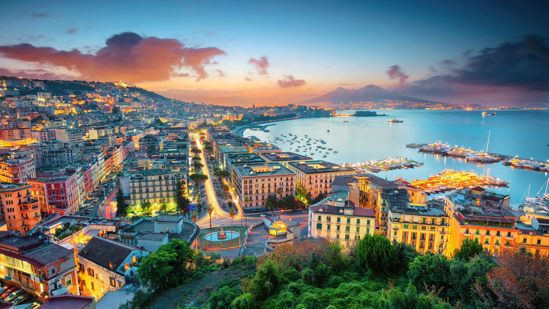 Panoramic evening view of Naples and the Bay of Naples with Mount Vesuvius in the distance
